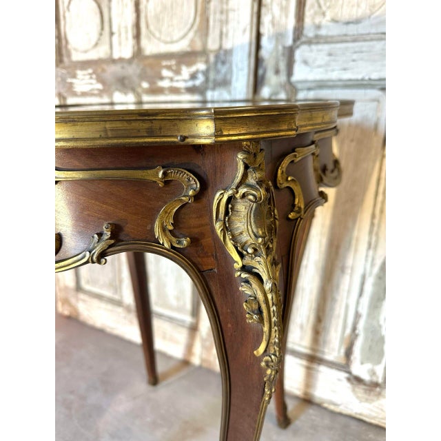 An elegant napoleon iii style table, dating from the late 19th century, perfectly illustrating the eclectic and refined...