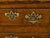 An English oak dresser base from the early 19th century with T-shaped drawers, semi Doric columns, two doors and brass...