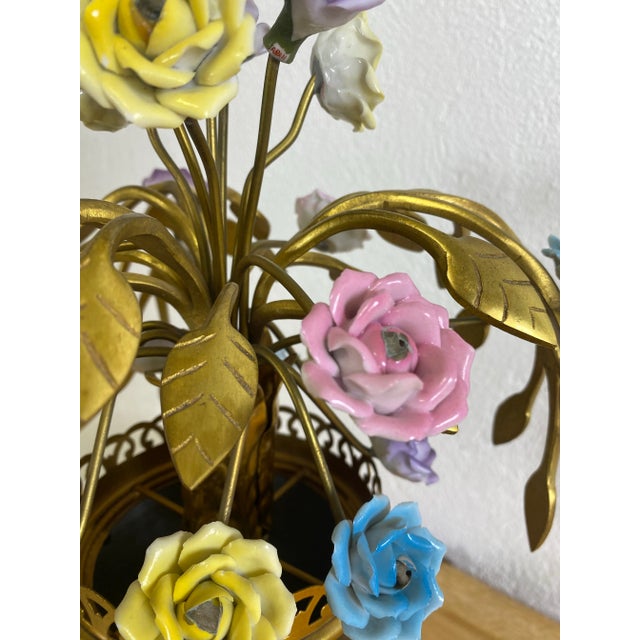 This is a mid century vintage Italian made decorator table lamp. This table lamp features a botanical inspired bouquet of...