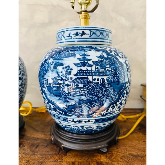 Bring timeless elegance to any room with this matched pair of vintage blue and white ginger jar lamps. Each lamp features...