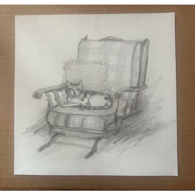 Charming original graphite drawing depicting a relaxed cat curled comfortably in a vintage upholstered armchair. Executed...