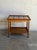 This versatile rolling service table exhibits a strong combination of traditional country craft and mid-century utility....