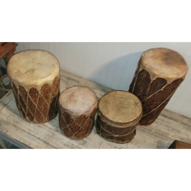 Collection of four wood and leather Pueblo Native American drums. Selling as a fantastic collection. All in good condition...