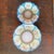 This antique porcelain set, resembling Limoges or R.S. Prussia styles, features a vibrant blue border, intricate gold gilt...