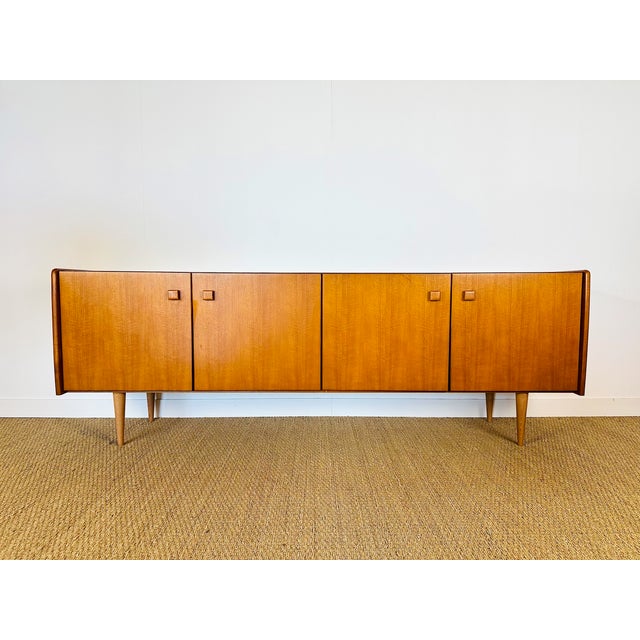Elegant and timeless, this large Scandinavian sideboard from the 1960s perfectly embodies the minimalist aesthetic of...