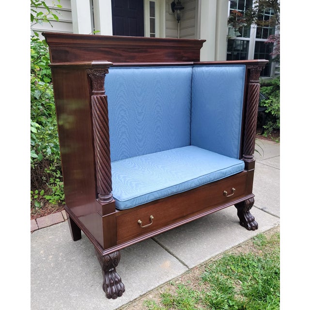 Featured is a sophisticated hand carved antique clawfoot Empire Style Hall Bench/Settee with 1 drawer adorned with brass...