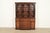 A gorgeous Georgian or Chippendale style breakfront bookcase or dining cabinet with drop front secretary desk By Baker...