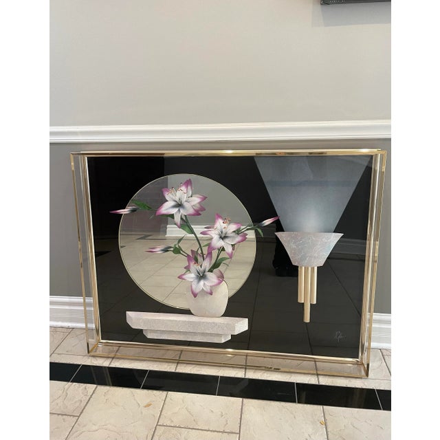 A glamorous 1980s lucite shadow box artwork by Jon Gilmore, featuring airbrushed lilies rendered in soft shades of white,...