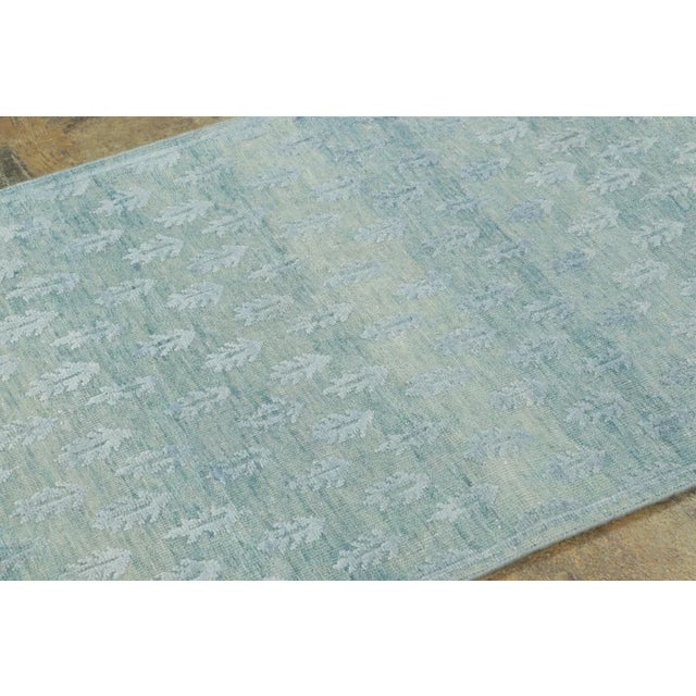 Made with hand-knotted natural silk, this 3x6 runner rug is a sophisticated addition to Rug & Kilim’s Block Print...