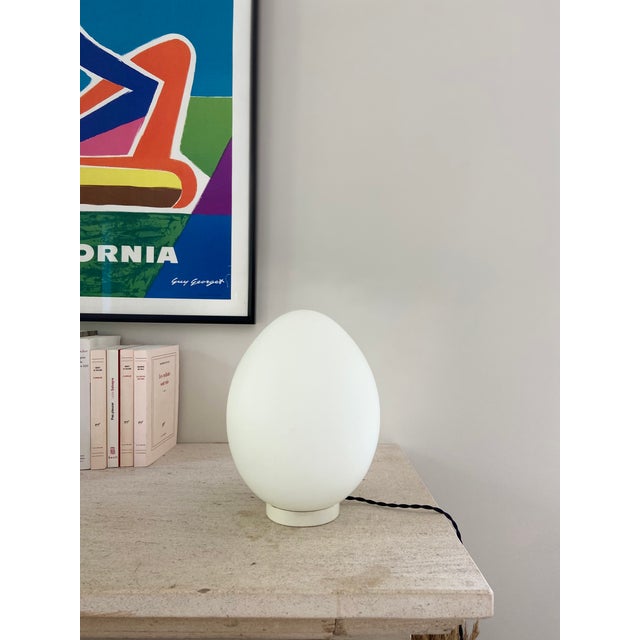 Smoked glass egg placed on a white metal base. Lamp inspired by the Ben Swildens model. Very good condition - electrical...