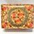 A large vintage Kashmiri papier-mâché box densely hand-painted with multicolored flowers, scrolling foliage, and intricate...