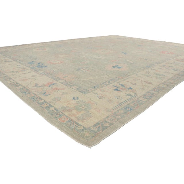 Polished and playful, this hand-knotted wool Oushak rug beautifully embodies a modern style. With elements of comfort,...