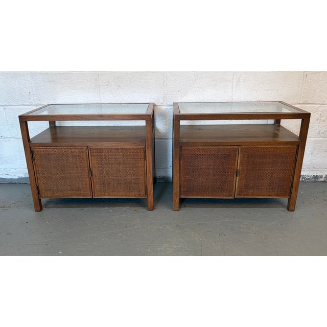 Stunning pair of Mid-Century cane and glass top end tables, a perfect blend of vintage charm and timeless design....