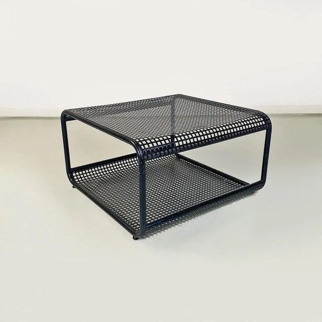Low table with matte black metal frame with square base and rounded corners, with tubular profiles and second lower shelf,...