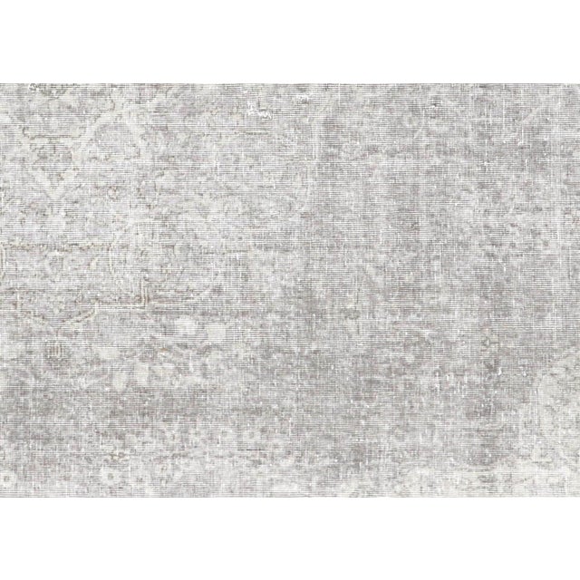 This substantial vintage Turkish Oushak rug represents the pinnacle of Anatolian weaving tradition, hand-knotted with wool...