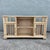 A striking vintage coastal credenza/étagère crafted in faux bamboo with a soft, sun-washed finish. The design features...