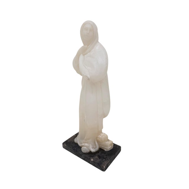 Antique hand carved alabaster figure of a woman.
