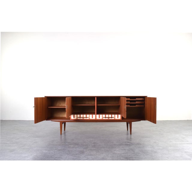 This teak sideboard was manufactured in Norway in the 1960s. The piece has been professionally and carefully restored by...