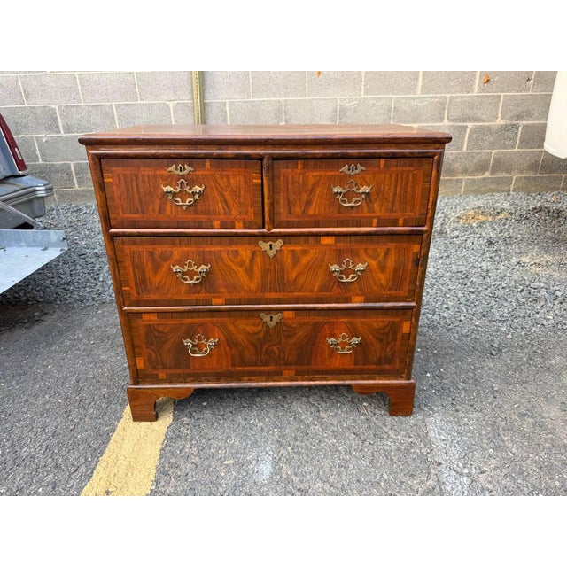 Antique Georgian Style Burr Walnut Chest of Drawers It features with 2 drawers over two long graduated drawers. Dovetail...