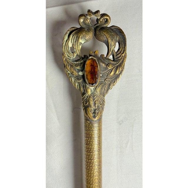 This large antique 19th century gilt bronze and embroidered petit point vanity hand mirror was exquisitely handmade in...