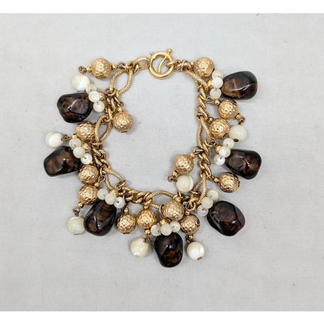 Napier Vintage 1960s Signed Napier Goldtone Faux-Topaz & Mother of Pearl Charm Bracelet For Sale - Image 4 of 14