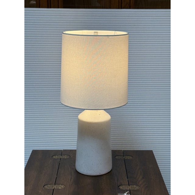 Design Plus Gallery presents the Leahy Table Lamp from Rejuvenation. The lamp has a sleek, Mid 20th Century design style...