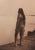 An original photogravure from Edward S. Curtis's The North American Indian. The Mohave shows a Mohave man standing on a...