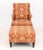 Baker Floral and Animal Upholstered Wingback Armchair and Ottoman, in burnt orange and golden accents, label to underside....