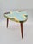 An elegant side/coffee table from the mid-century modern period, manufactured in germany by howa (holzwarenfabrik...