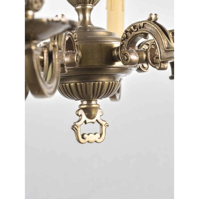 High-quality chandelier made of patinated brass. 8 arms. The chandelier is for classic candle bulbs with an e14 base up to...