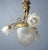 The antique art nouveau chandelier made of gilded bronze represents an exceptionally decorative example of the artistic...
