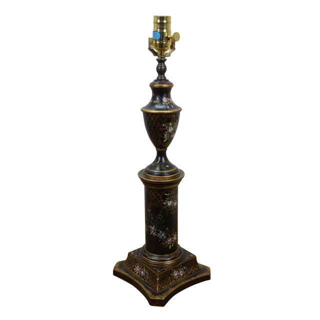 Vintage pair of Chelsea House table lamps featuring a Neoclassical black tole painted floral design with a cylindrical...