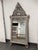 Design Plus Gallery presents a Vintage Syrian Mother-of-Pearl inlaid leaning Mirror. An ornate mirror with intricate...