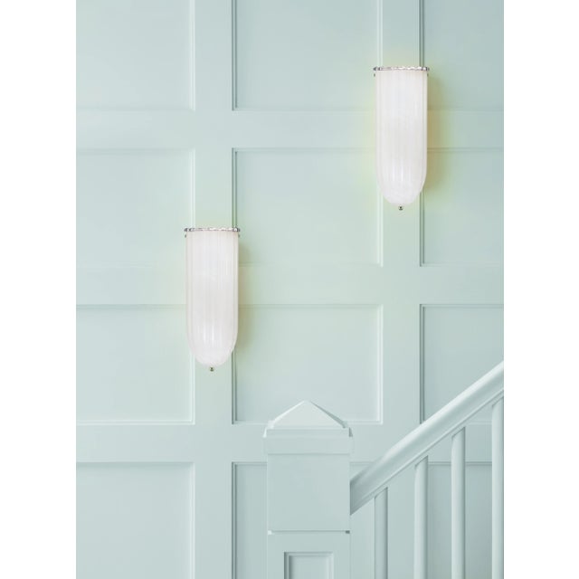 Rosehill Linear Wall Light in Polished Nickel with White Strie Glass Designer: AERIN Height: 15" Extension: 4.75"...