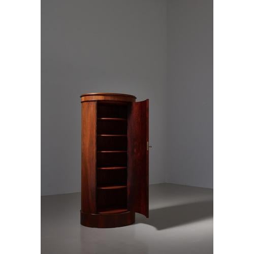 Rare and beautiful Danish Modern oval shaped rosewood pedestal cabinet "model 205" designed by Johannes Sorth and produced...