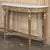 Antique French Louis XVI Giltwood Demilune Console with Carrara Marble is a masterpiece of elegance that will provide the...