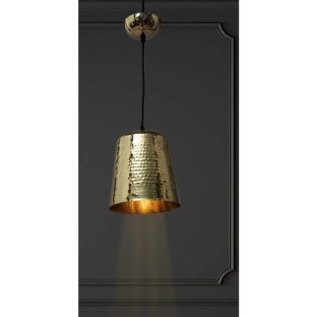 Add warmth and character to your interior with this stylish hammered brass pendant light. Featuring a beautifully textured...