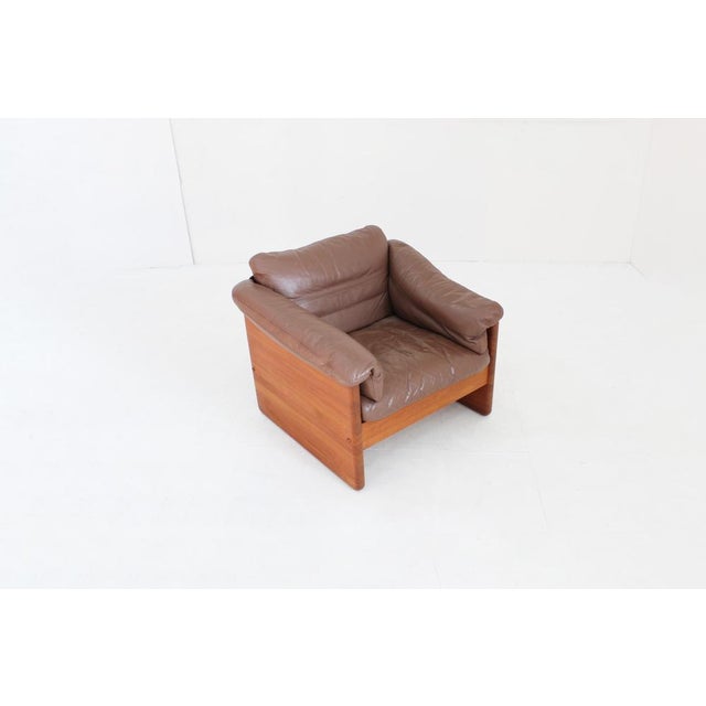Vintage Danish Mid Century armchair in solid teak wood designed by Mikael Laursen in the 1960s. Solid teak armchairs with...