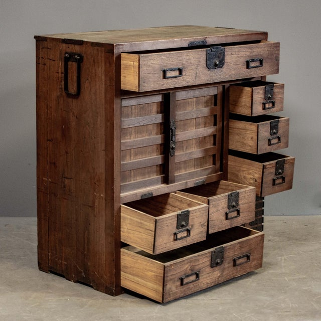 Antique Japanese merchant chest ” Choba Tansu” crafted from paulownia wood and accented with hand made iron hardware...