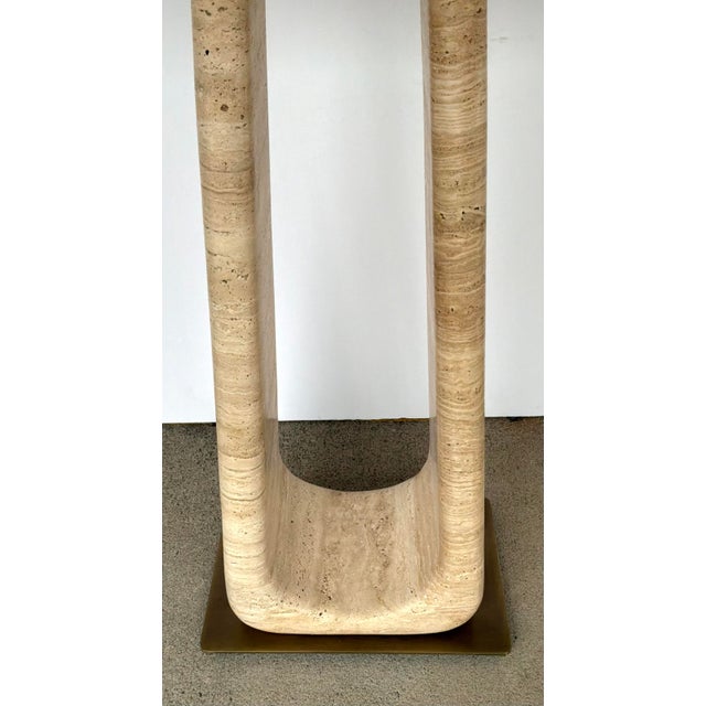 Original retail $2916, stylish Revelation Modern Travertine About Turn Console Table, antique brass accents, showroom...