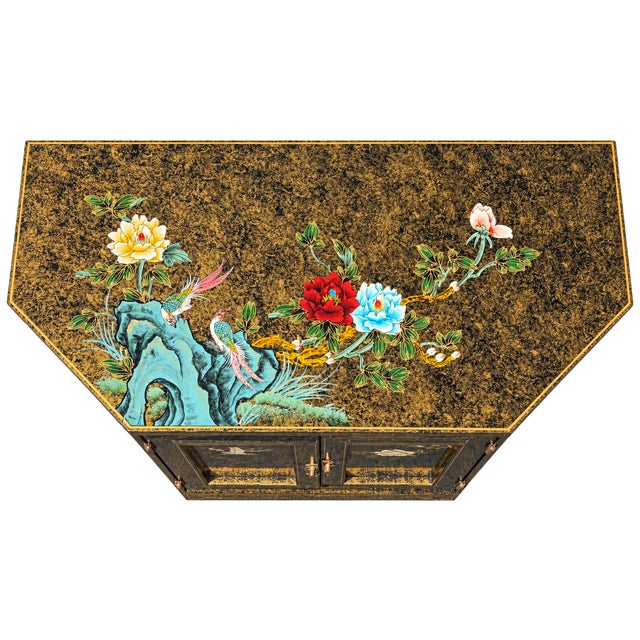Chinese black and gold lacquer cabinet, made in China and dating to the late 20th century, likely circa 1980s–1990s. The...
