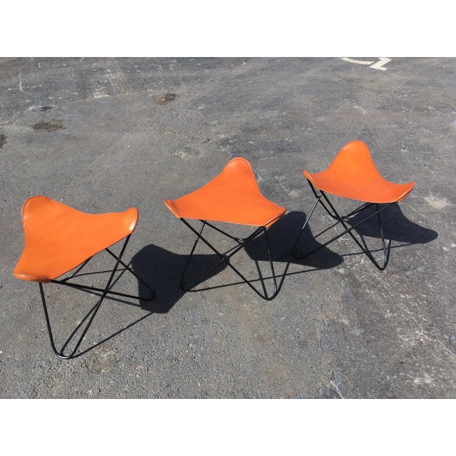 Beautiful stools, black painted iron and saddle leather. Six stools available.