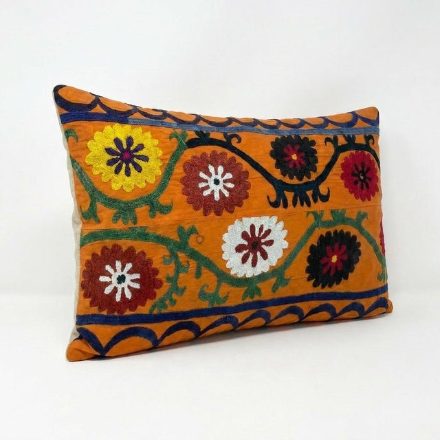 This beautiful 18'' x 26'' hand-embroidered Suzani pillow cover was made from authentic Uzbek cotton fabric. The intricate...