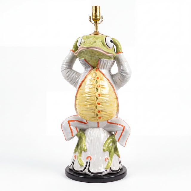 This is a large scale Hollywood Regency era Italian ceramic frog form table lamp. He has fabulous vivid colors, and the...