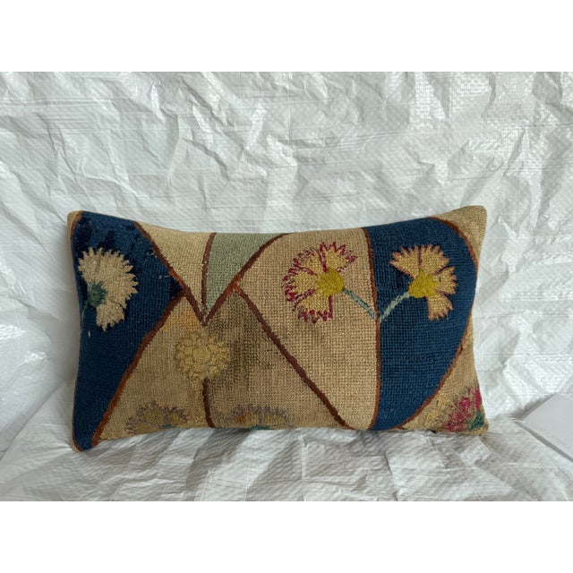 This distinctive pillow is made from an antique 17th-century Italian Florentine wool textile, preserving a fragment of the...