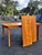 Mid-century modern natural extendable dining table. Includes two self-storing leafs. Constructed in the style of Heywood-...