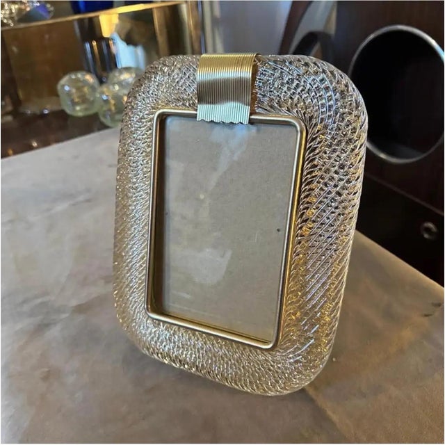 A clear and gold murano glass picture frame designed and manufactured in Venice in the style of Barovier, it's in lovely...