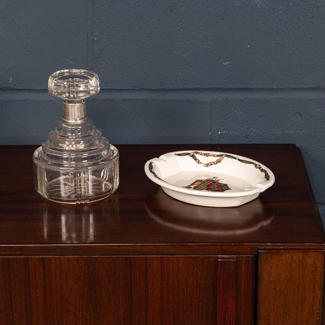 A stylish ceramic ashtray by gucci, crafted in italy in the late 20th century. The piece features a classic equestrian-...