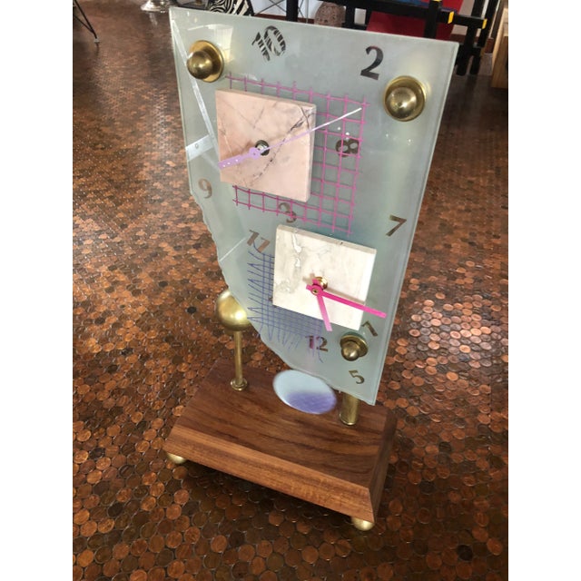 This one of a kind artisan clock is made of multiple materials. Sandblasted and painted glass, walnut, brass and painted...