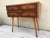 Wooden cupboard from the 1950s Vintage Design. High-quality wooden cabinet with 4 drawers, and long legs detached for...